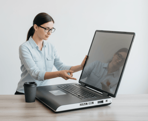 A professional resume document with a signature floating above a desk, shown next to a tablet displaying the clean, interactive input form of the HubDev.in resume builder tool.
